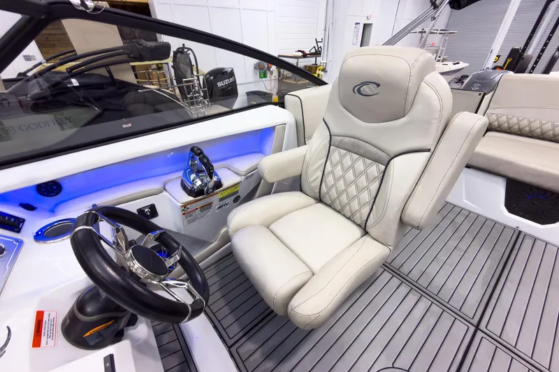 Slide: The Image of 2020 Crest Continental 270 NX-L Twin boat interior with luxury seating and modern controls. - 22