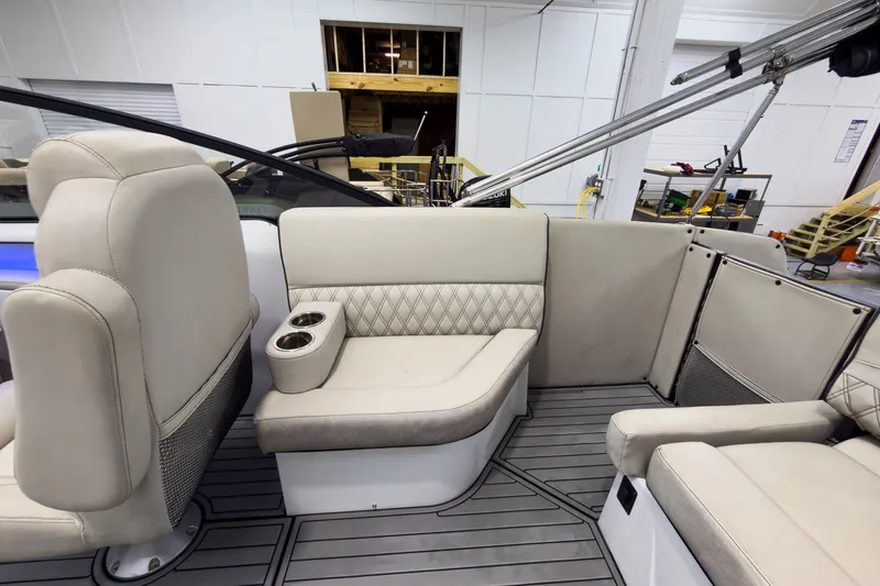 Slide: The Image of 2020 Crest Continental 270 NX-L Twin boat interior with beige seating and cup holders. - 32