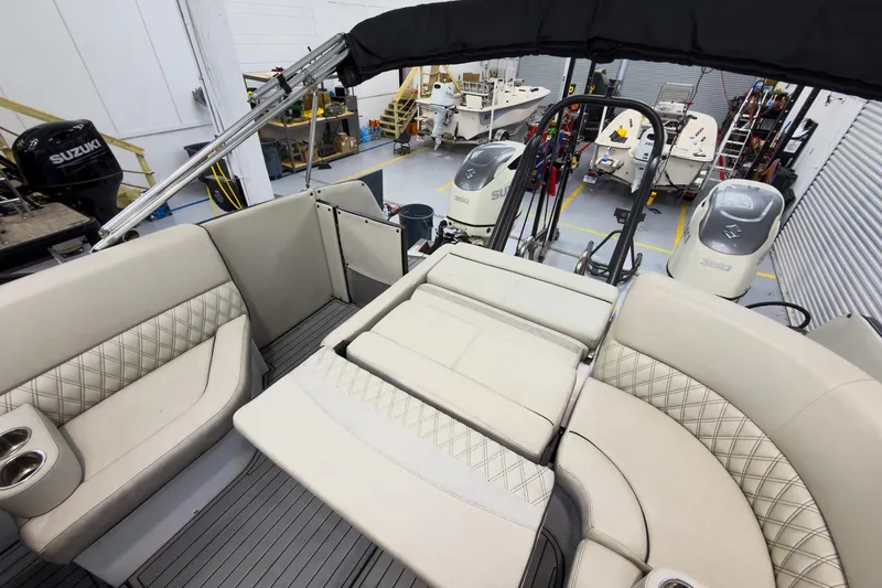 Slide: The Image of 2020 Crest Continental 270 NX-L Twin boat interior with luxurious seating in a workshop. - 35
