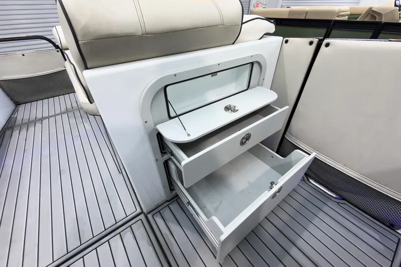 Slide: The Image of 2020 Crest Continental 270 NX-L Twin boat interior with open storage drawers. - 43