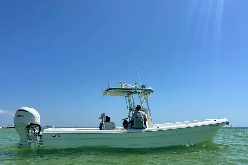 The Image of 2014 Andros Tarpon 26 boat on clear water under blue sky. - 0