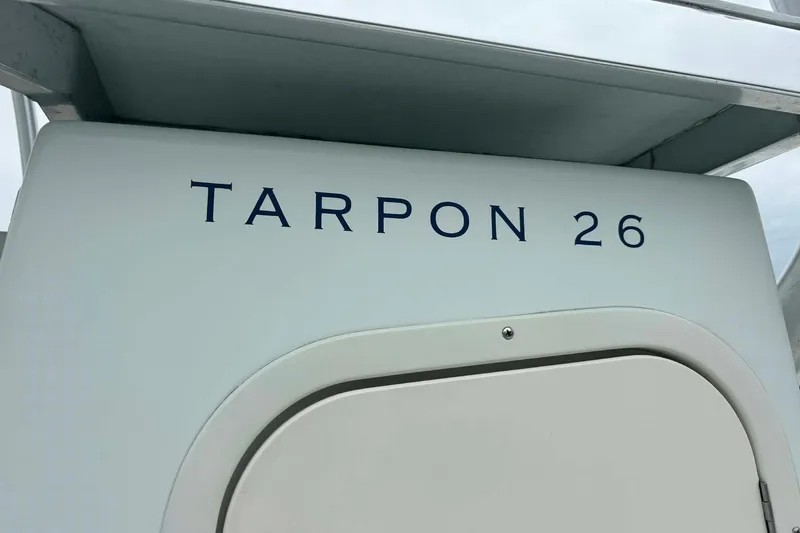 Slide: The Image of 2014 Andros Tarpon 26 boat, close-up of model name on the hull. - 15