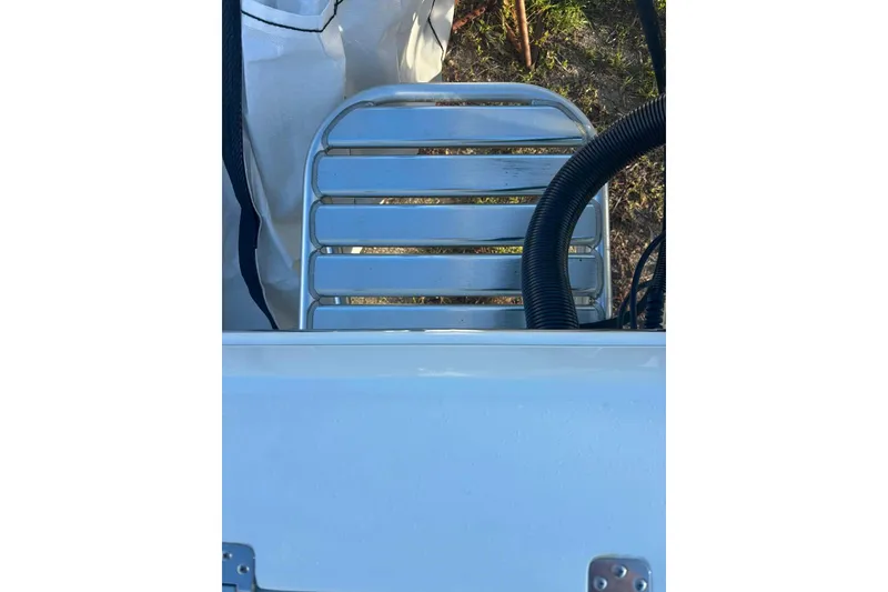 Slide: The Image of 2014 Andros Tarpon 26 boat ladder and deck detail with hose. - 18