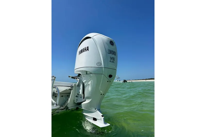 Slide: The Image of 2014 Andros Tarpon 26 with Yamaha 300 V6 outboard in clear green water. - 21