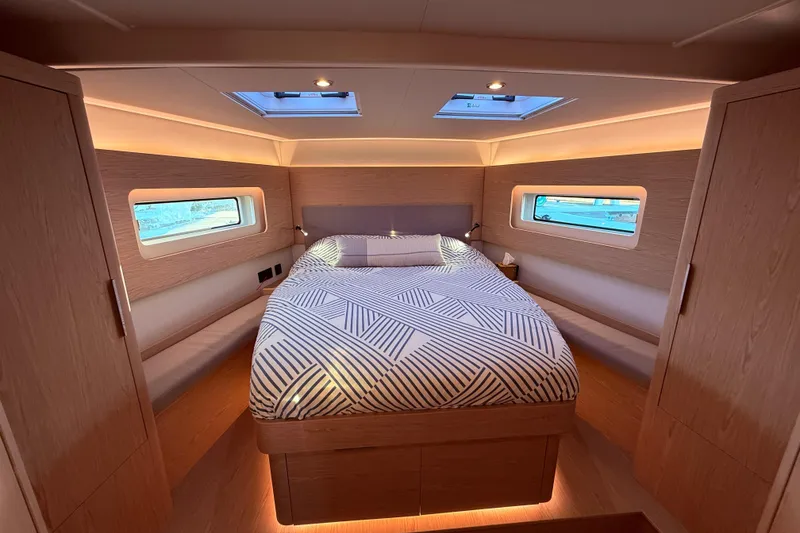 Slide: The Image of Luxurious cabin interior of 2022 Beneteau Oceanis Yacht 54 with modern design and ambient lighting. - 47