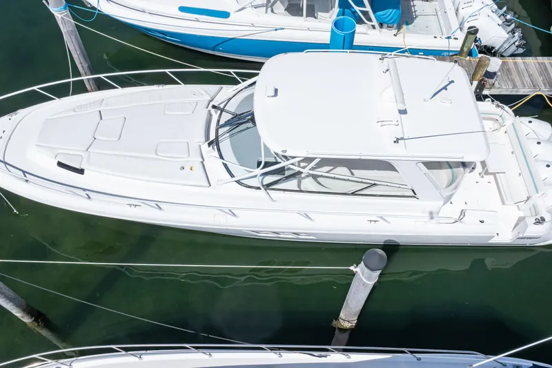 Slide: The Image of 2018 Intrepid 475 Sport Yacht docked in marina, aerial view. - 11