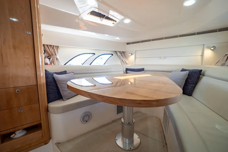 Slide: The Image of Luxurious interior of 2018 Intrepid 475 Sport Yacht with elegant seating and wooden table. - 121