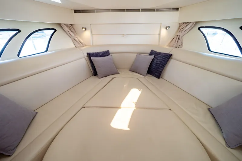 Slide: The Image of Luxurious interior of 2018 Intrepid 475 Sport Yacht with plush seating and cushions. - 13