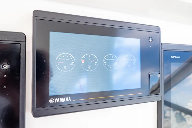 Slide: The Image of Yamaha display panel on 2018 Intrepid 475 Sport Yacht dashboard showing gauges. - 142