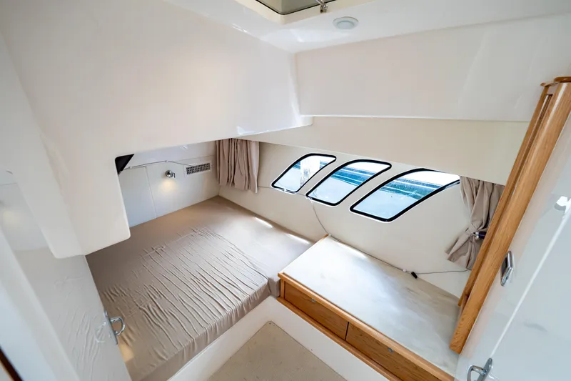 Slide: The Image of Luxurious cabin interior of 2018 Intrepid 475 Sport Yacht with modern design and ample natural light. - 16