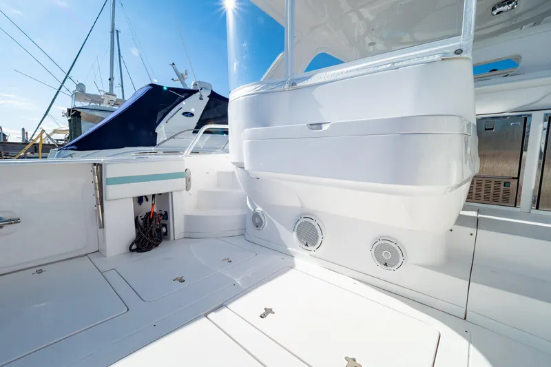 Slide: The Image of 2018 Intrepid 475 Sport Yacht deck with modern amenities and sleek design. - 47