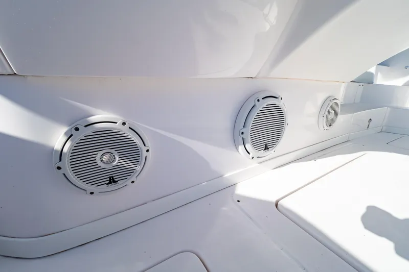 Slide: The Image of Speakers on 2018 Intrepid 475 Sport Yacht's sleek white interior. - 52