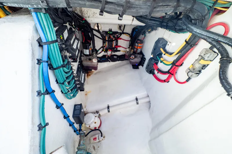 Slide: The Image of Electrical wiring and components inside a 2018 Intrepid 475 Sport Yacht. - 56