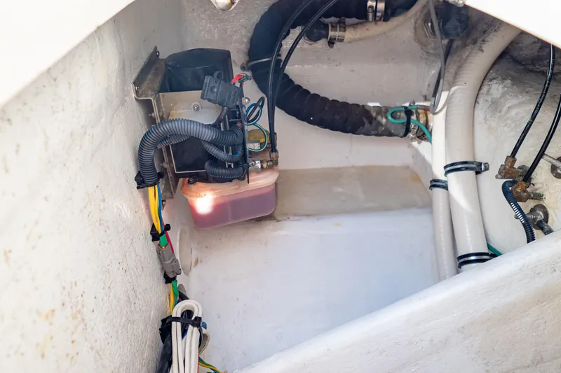 Slide: The Image of Engine compartment of a 2018 Intrepid 475 Sport Yacht, showing wiring and components. - 63