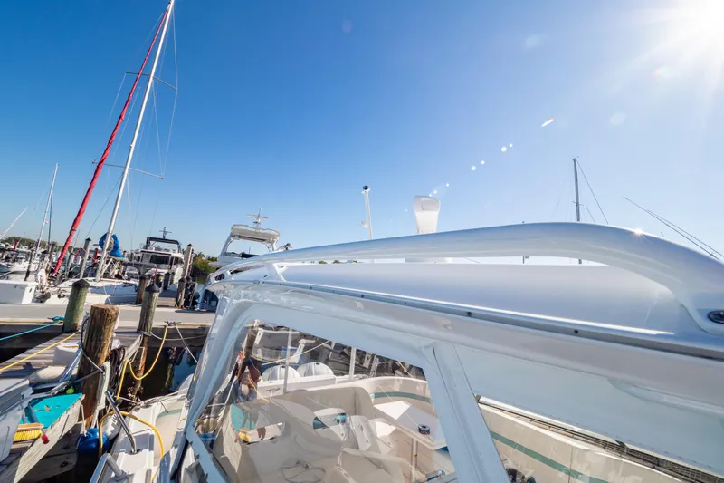 Slide: The Image of 2018 Intrepid 475 Sport Yacht docked under clear blue sky. - 76