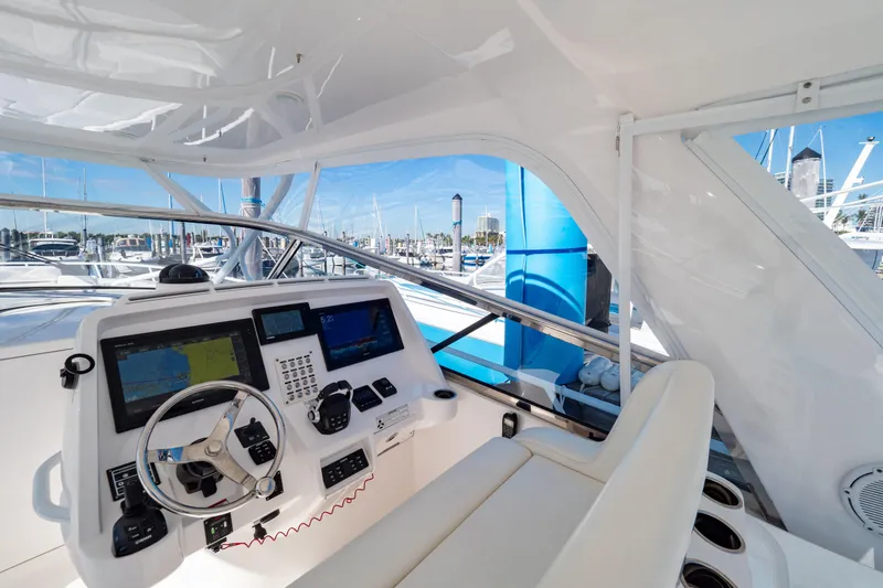 Slide: The Image of Helm of 2018 Intrepid 475 Sport Yacht with modern navigation equipment and luxurious seating. - 87