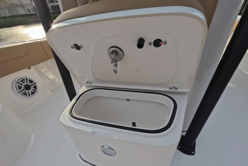 Slide: The Image of 2024 Caymas 281 HB boat with open storage compartment and speaker. - 12