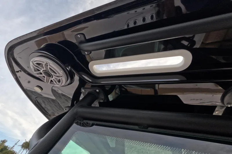 Slide: The Image of 2024 Caymas 281 HB boat roof with speaker and light detail. - 22