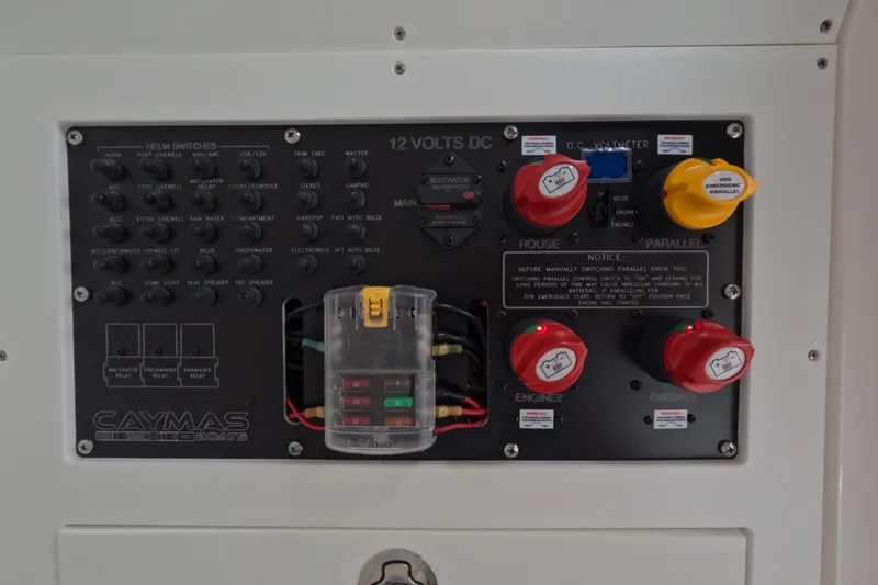 Slide: The Image of 2024 Caymas 281 HB boat control panel with switches and battery controls. - 27