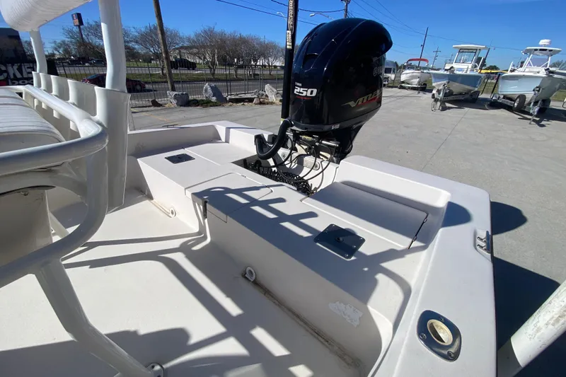 Slide: The Image of 2001 Pathfinder 2400 V boat with Yamaha 250 engine, parked outdoors. - 11