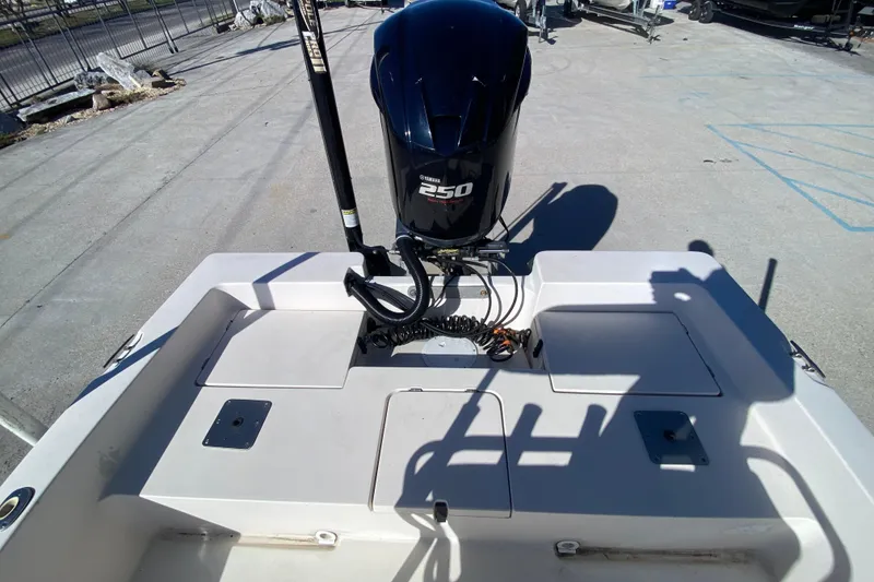 Slide: The Image of 2001 Pathfinder 2400 V boat with Yamaha 250 engine, docked on concrete surface. - 12