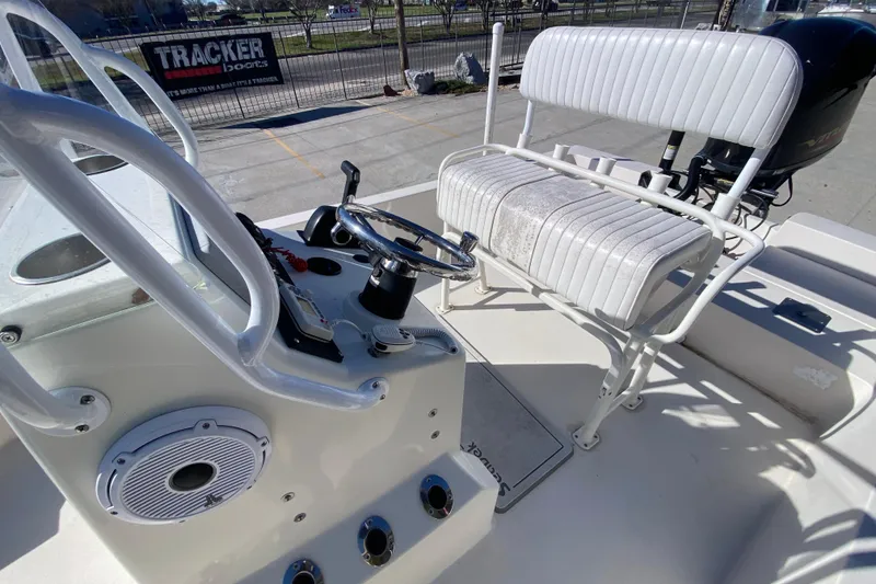 Slide: The Image of 2001 Pathfinder 2400 V boat interior with steering wheel and seating. - 13
