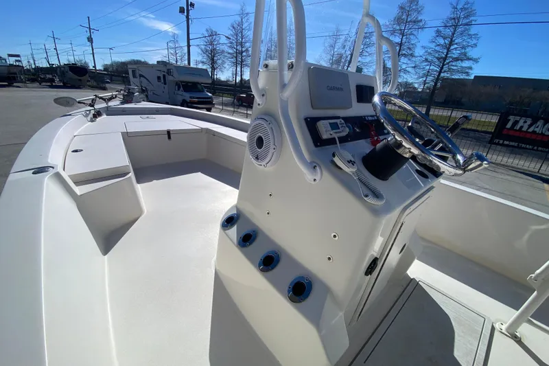 Slide: The Image of 2001 Pathfinder 2400 V boat interior with steering console and seating area. - 16