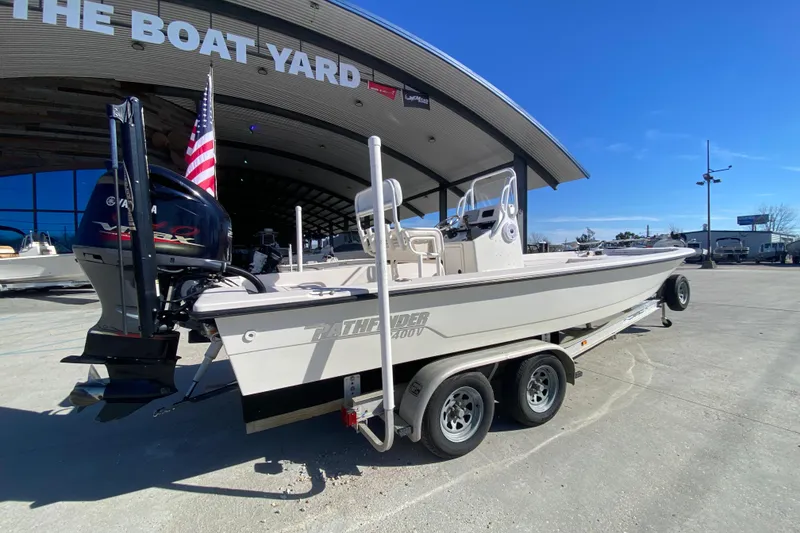 Slide: The Image of 2001 Pathfinder 2400 V boat on trailer at The Boat Yard, featuring Yamaha outboard motor. - 3