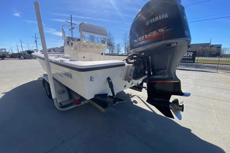 Slide: The Image of 2001 Pathfinder 2400 V boat with Yamaha VMAX outboard motor in a sunny parking lot. - 5