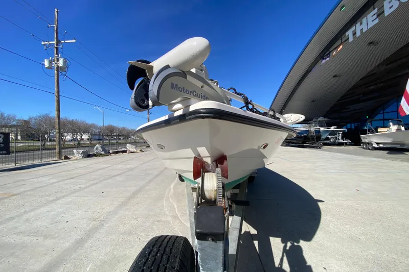 Slide: The Image of 2001 Pathfinder 2400 V boat on trailer, featuring MotorGuide trolling motor. - 8