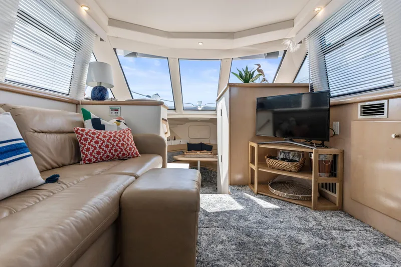 Slide: The Image of Luxurious interior of 2000 Carver 326 Aft Cabin Motor Yacht with cozy seating and modern decor. - 13