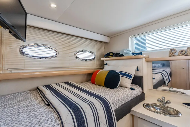 Slide: The Image of Cozy cabin interior of 2000 Carver 326 Aft Cabin Motor Yacht with nautical decor. - 15