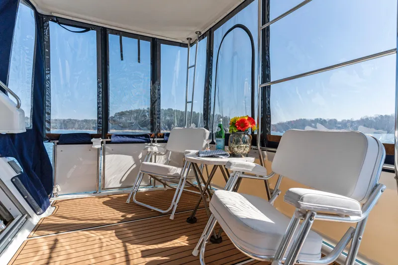 Slide: The Image of Aft cabin of 2000 Carver 326 Motor Yacht with seating and scenic views. - 22