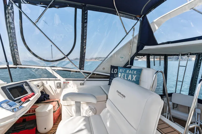 Slide: The Image of Interior of 2000 Carver 326 Aft Cabin Motor Yacht with seating and navigation equipment. - 26