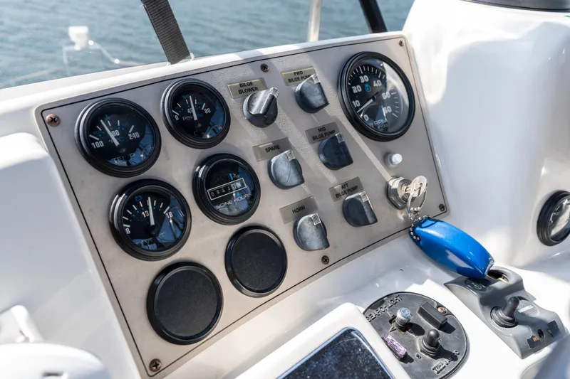 Slide: The Image of Control panel of 2000 Carver 326 Aft Cabin Motor Yacht with gauges and switches. - 27