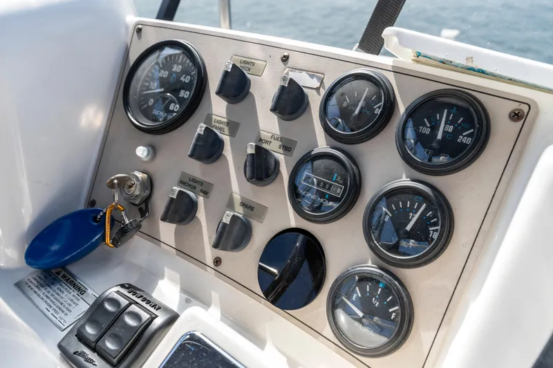 Slide: The Image of Control panel of 2000 Carver 326 Aft Cabin Motor Yacht with gauges and switches. - 31