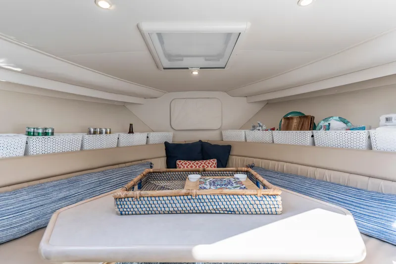 Slide: The Image of Interior of 2000 Carver 326 Aft Cabin Motor Yacht with cozy seating and storage. - 4