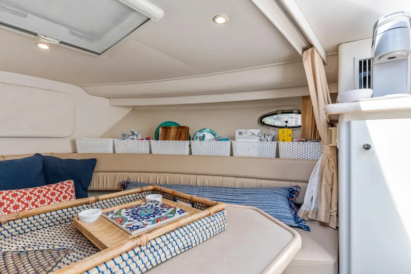 Slide: The Image of Interior of 2000 Carver 326 Aft Cabin Motor Yacht with cozy seating and storage. - 5