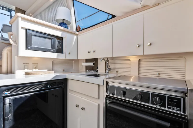 Slide: The Image of Interior of 2000 Carver 326 Aft Cabin Motor Yacht kitchen with appliances. - 8