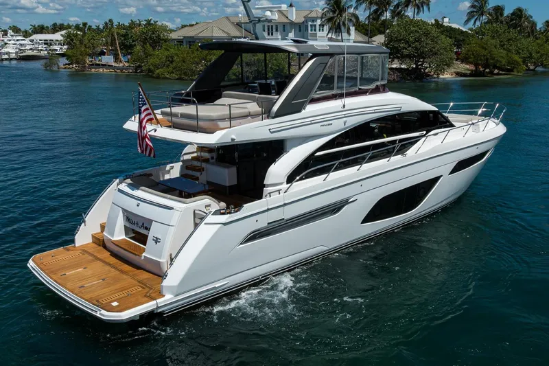 Slide: The Image of Luxurious 2020 Princess F70 yacht cruising in scenic waters, featuring elegant design and spacious deck. - 11