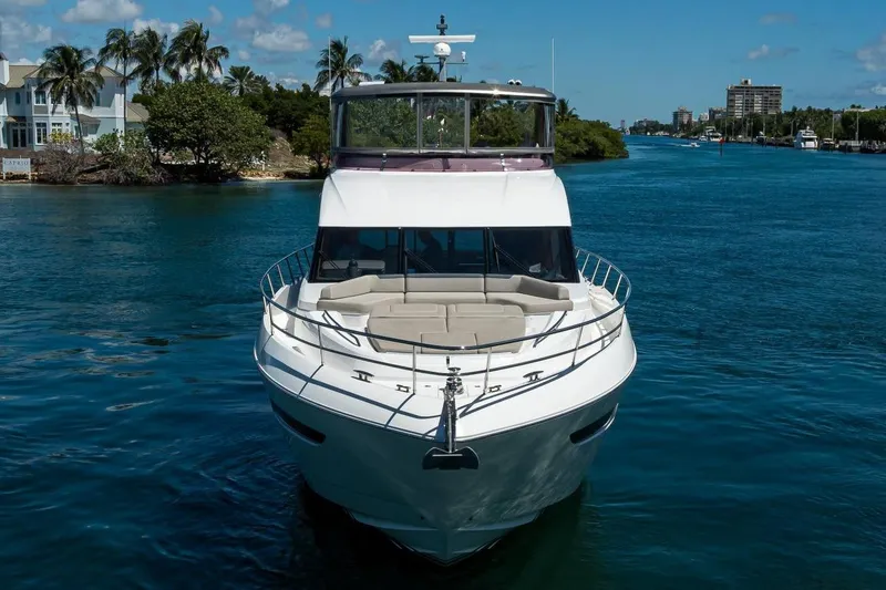 Slide: The Image of Luxury 2020 Princess F70 yacht cruising on a scenic waterway with palm trees. - 14