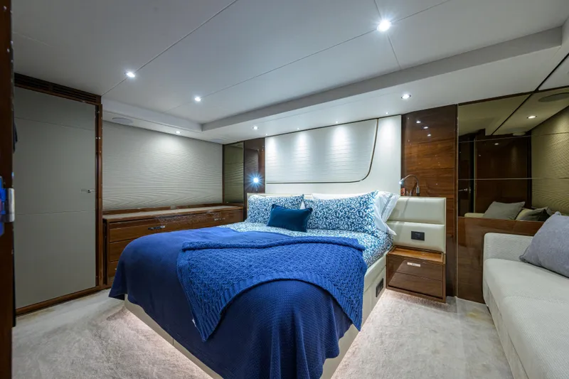 Slide: The Image of Luxurious bedroom interior of 2020 Princess F70 yacht with elegant blue bedding. - 37