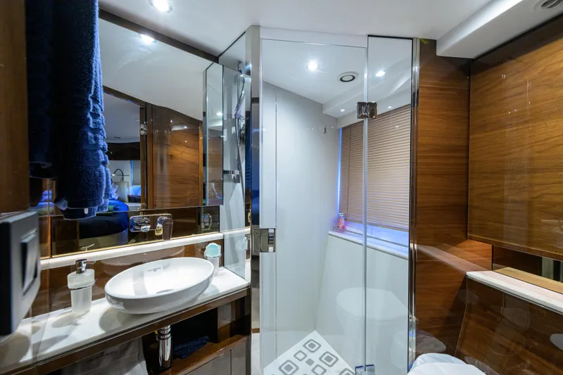 Slide: The Image of Luxurious bathroom in 2020 Princess F70 yacht with modern fixtures and elegant wood finishes. - 43