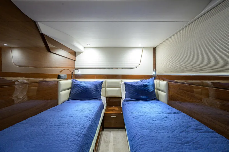 Slide: The Image of Luxurious twin cabin interior of 2020 Princess F70 yacht with blue bedding. - 44
