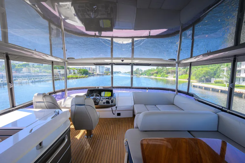 Slide: The Image of Luxurious 2020 Princess F70 yacht interior with panoramic views and elegant seating. - 54