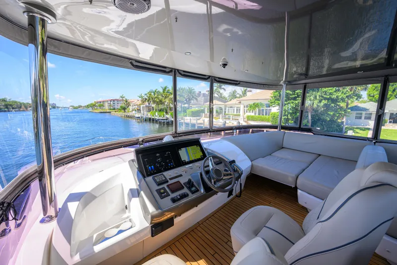 Slide: The Image of Luxurious 2020 Princess F70 yacht interior with modern helm and spacious seating area. - 56