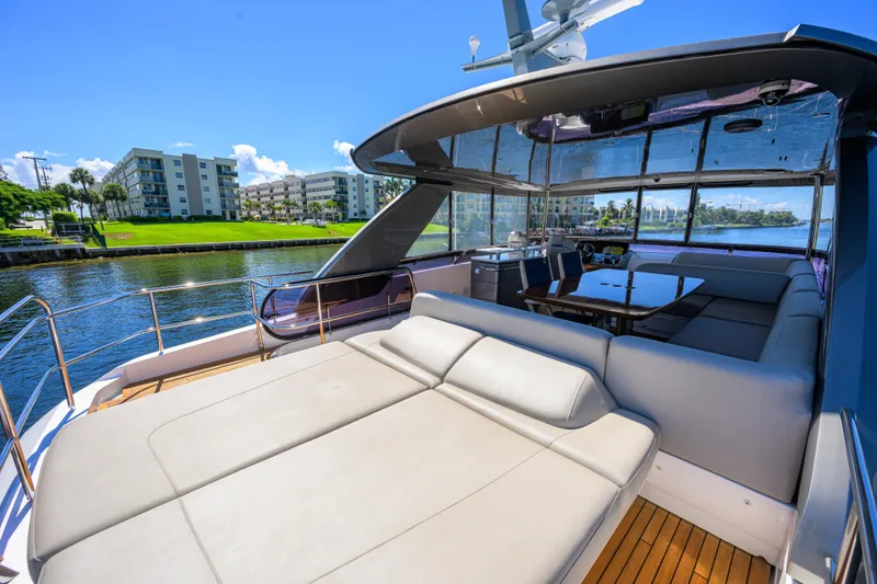 Slide: The Image of Luxurious 2020 Princess F70 yacht interior with spacious seating and waterfront view. - 60