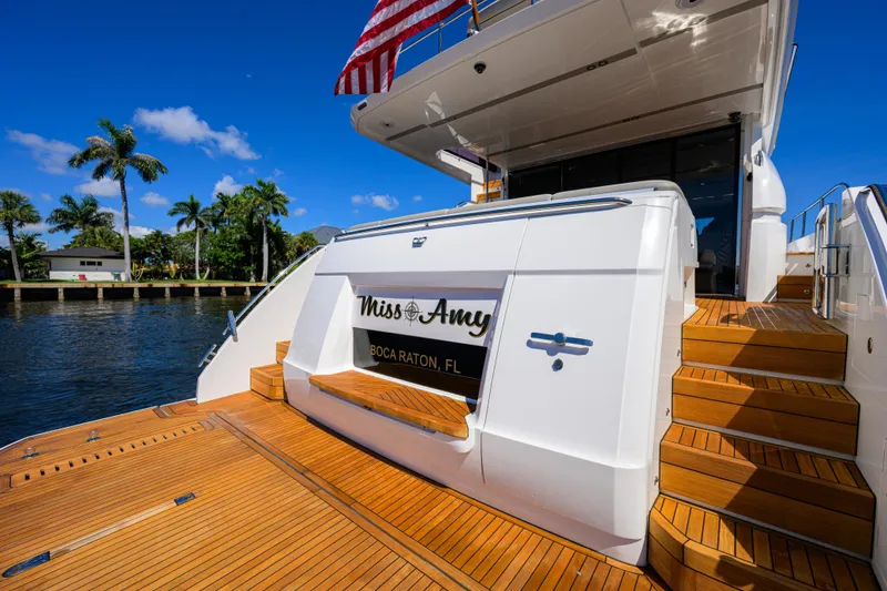 Slide: The Image of Luxury 2020 Princess F70 yacht docked in Boca Raton, Florida, with wooden deck and stairs. - 66