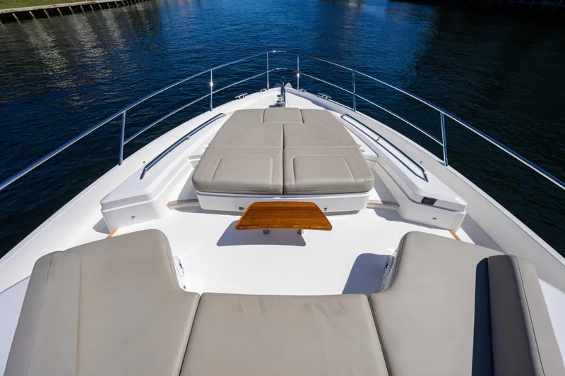 Slide: The Image of Luxurious 2020 Princess F70 yacht deck with cushioned seating and sleek design. - 67