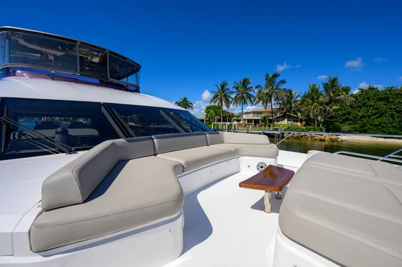 Slide: The Image of Luxurious 2020 Princess F70 yacht with spacious deck seating, palm trees in background. - 68